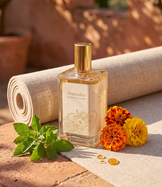 Svara fragrance bottle with tulsi and marigold on yoga mat, best perfume yoga meditation India