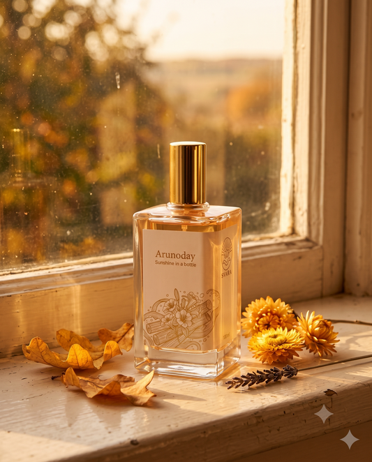 Svara perfume bottle styled with autumn light and dried leaves on a windowsill